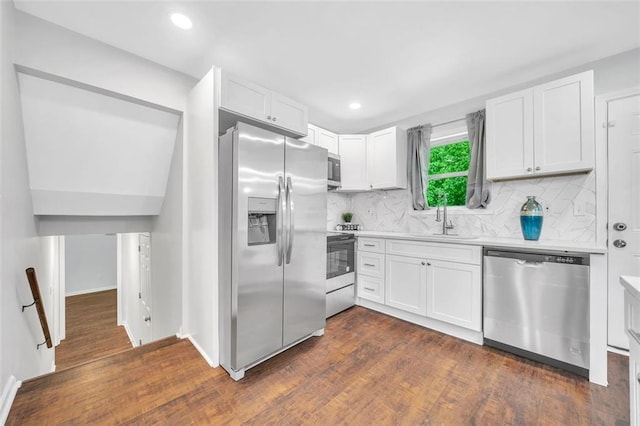 1893 Burning Tree Dr, Decatur, GA 30032 - kitchen with a sink, light countertops, stainless steel appliances, white cabinetry, and dark wood-style flooring