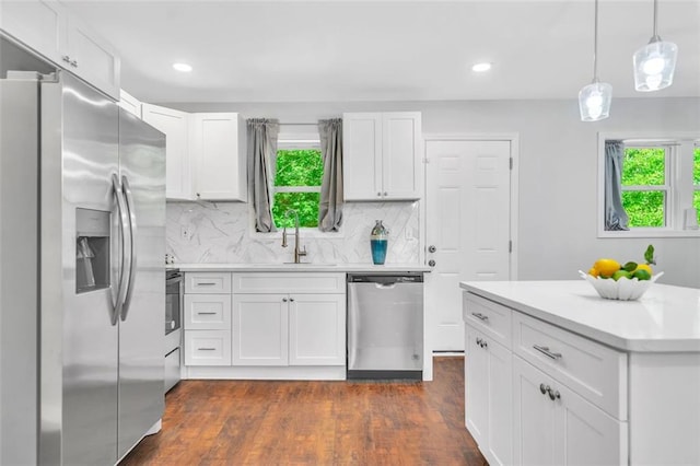 1893 Burning Tree Dr, Decatur, GA 30032 - kitchen with white cabinetry, light countertops, plenty of natural light, and stainless steel appliances