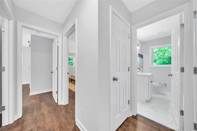 1893 Burning Tree Dr, Decatur, GA 30032 - corridor featuring visible vents, marble finish floor, baseboards, and a sink