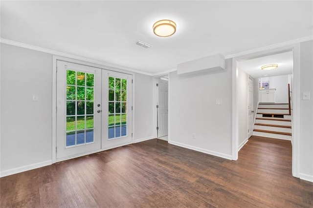 1893 Burning Tree Dr, Decatur, GA 30032 - empty room with wood finished floors, baseboards, french doors, and ornamental molding