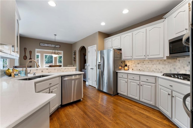1254 Hadaway Garden Dr NW, Kennesaw, GA 30152 - kitchen featuring appliances with stainless steel finishes, white cabinets, wood finished floors, plenty of natural light, and recessed lighting