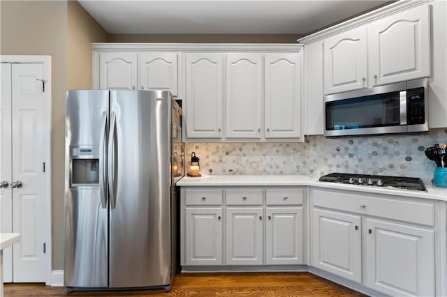 1254 Hadaway Garden Dr NW, Kennesaw, GA 30152 - kitchen with appliances with stainless steel finishes, white cabinetry, backsplash, and light countertops