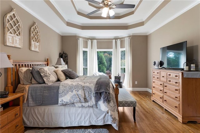 1254 Hadaway Garden Dr NW, Kennesaw, GA 30152 - bedroom featuring a raised ceiling, light wood finished floors, crown molding, and ceiling fan