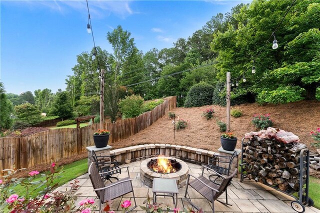 1254 Hadaway Garden Dr NW, Kennesaw, GA 30152 - view of patio with an outdoor fire pit