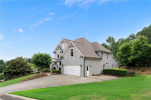 1254 Hadaway Garden Dr NW, Kennesaw, GA 30152 - view of home's exterior featuring a garage, a yard, concrete driveway, and brick siding