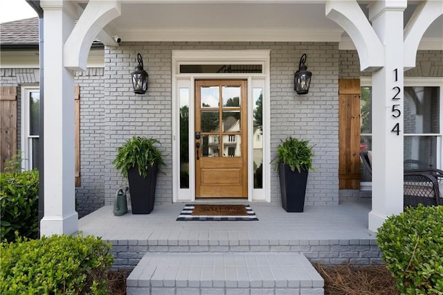 1254 Hadaway Garden Dr NW, Kennesaw, GA 30152 - view of exterior entry with brick siding and a porch