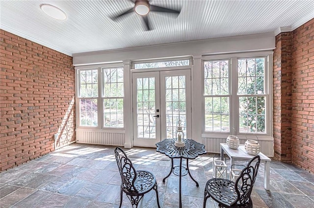 sunroom featuring french doors and a healthy amount of sunlight