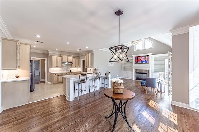 interior space featuring recessed lighting, baseboards, ornamental molding, and a high end fireplace