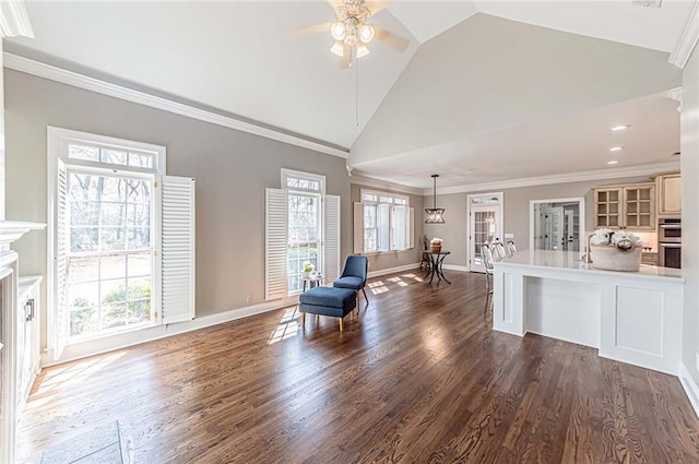living area featuring high vaulted ceiling, dark wood-style flooring, crown molding, a ceiling fan, and baseboards