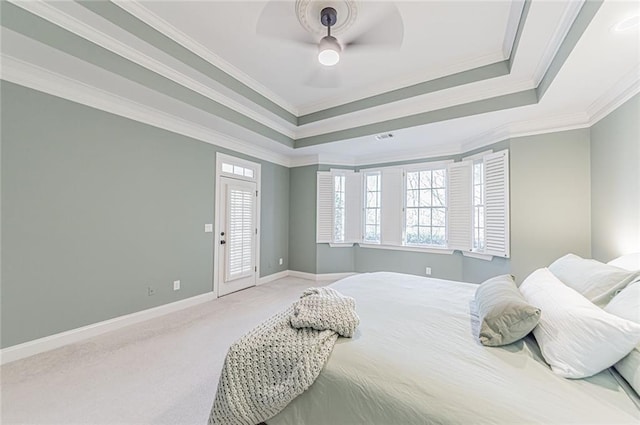 bedroom featuring a raised ceiling, carpet flooring, access to outside, and crown molding