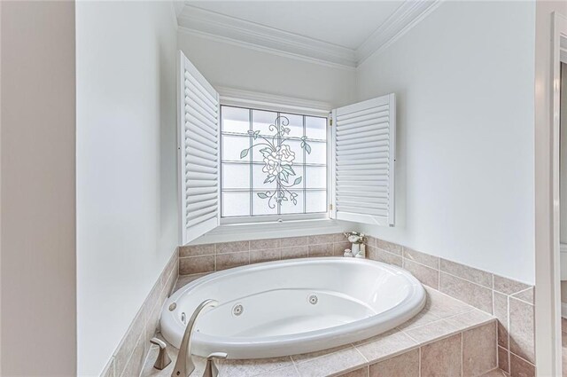 full bathroom featuring ornamental molding and a jetted tub