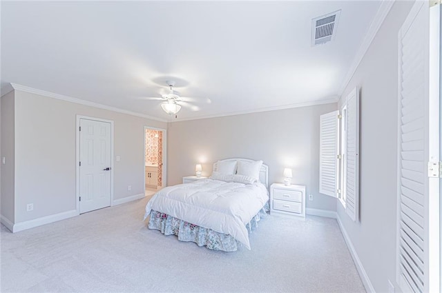 bedroom with light colored carpet, baseboards, and ornamental molding