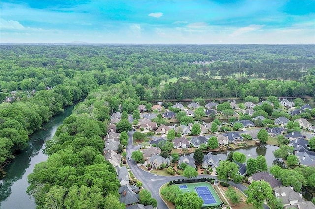 aerial view with a water view, a forest view, and a residential view