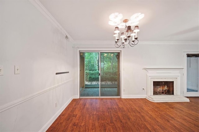 5400 Roswell Rd Unit L-3, Atlanta, GA 30342 - unfurnished living room with a chandelier, wood finished floors, ornamental molding, and a lit fireplace