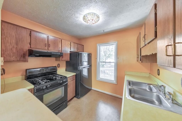 350 Pleasant Oak Ct SW, Marietta, GA 30008 - kitchen featuring under cabinet range hood, black appliances, a sink, light countertops, and a textured ceiling