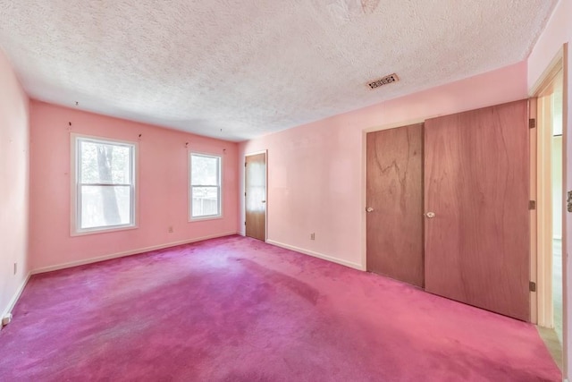 350 Pleasant Oak Ct SW, Marietta, GA 30008 - unfurnished bedroom with baseboards, a textured ceiling, and carpet flooring