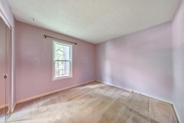 350 Pleasant Oak Ct SW, Marietta, GA 30008 - empty room featuring baseboards, a textured ceiling, and carpet