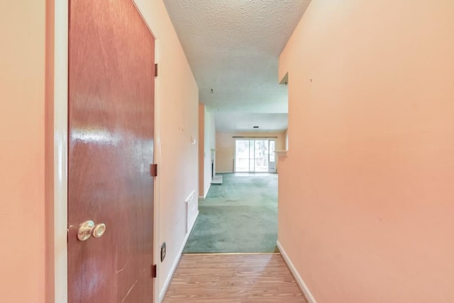350 Pleasant Oak Ct SW, Marietta, GA 30008 - hall featuring baseboards, light wood finished floors, and a textured ceiling