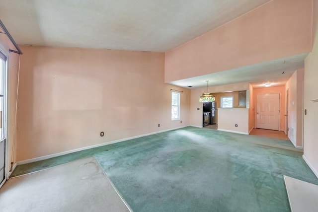 350 Pleasant Oak Ct SW, Marietta, GA 30008 - unfurnished living room featuring carpet flooring, baseboards, and high vaulted ceiling
