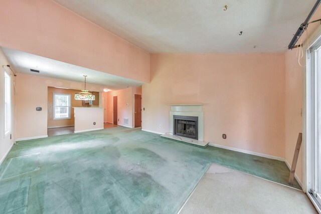 350 Pleasant Oak Ct SW, Marietta, GA 30008 - unfurnished living room with carpet flooring, baseboards, and a fireplace with raised hearth