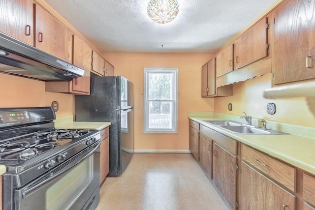 350 Pleasant Oak Ct SW, Marietta, GA 30008 - kitchen with black appliances, under cabinet range hood, a sink, baseboards, and light countertops