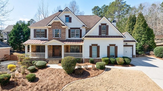 craftsman-style home with driveway, a standing seam roof, a porch, a chimney, and metal roof