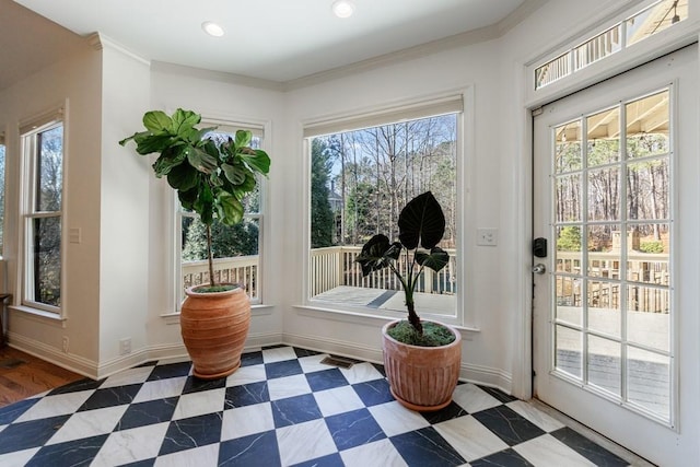 entryway with tile patterned floors, crown molding, recessed lighting, and baseboards