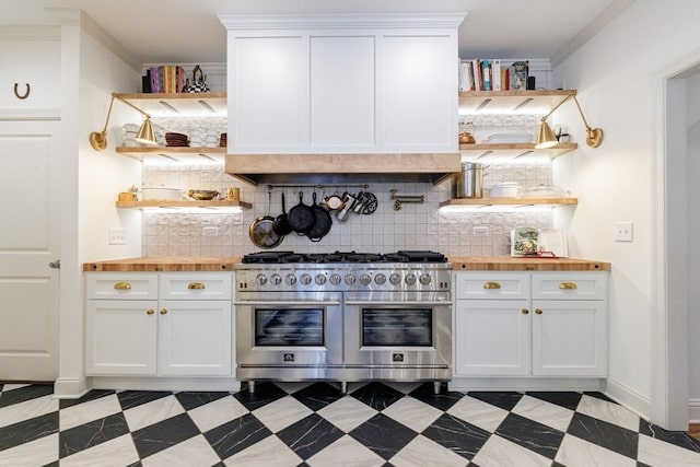 kitchen with white cabinetry, open shelves, double oven range, and wooden counters