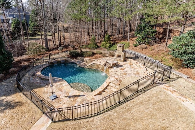 view of pool with a fenced in pool and fence