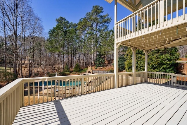 wooden terrace with a covered pool