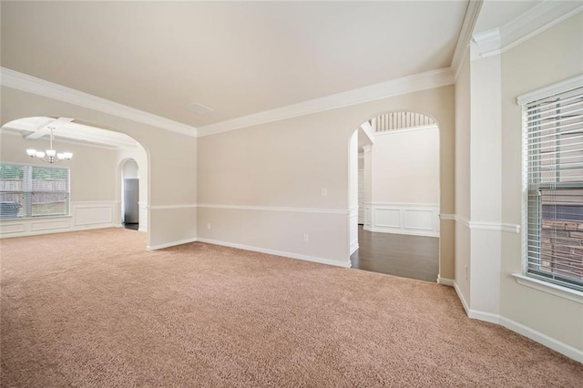 212 Jetta Cir, Mcdonough, GA 30253 - empty room with arched walkways, carpet floors, ornamental molding, and a chandelier