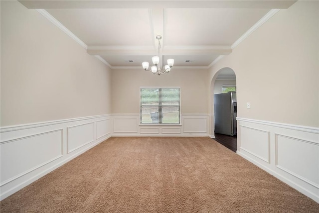 212 Jetta Cir, Mcdonough, GA 30253 - spare room featuring ornamental molding, coffered ceiling, carpet, a chandelier, and arched walkways