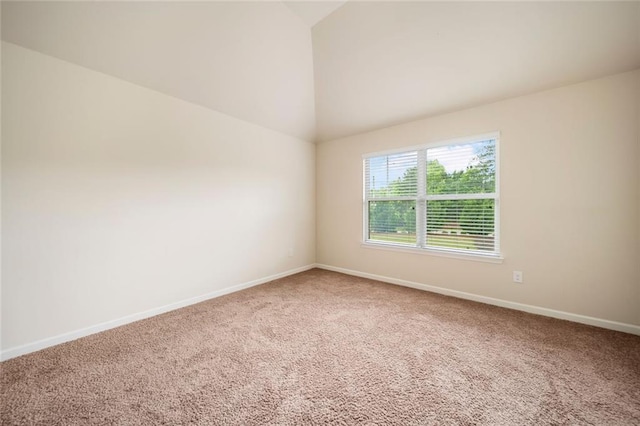 212 Jetta Cir, Mcdonough, GA 30253 - empty room with vaulted ceiling, carpet, and baseboards