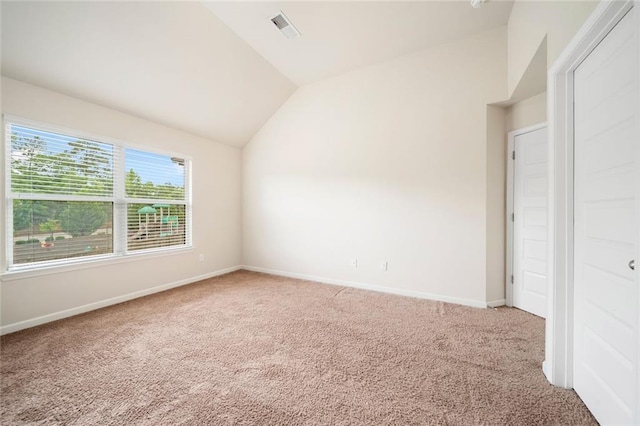 212 Jetta Cir, Mcdonough, GA 30253 - unfurnished bedroom with lofted ceiling, light carpet, and baseboards