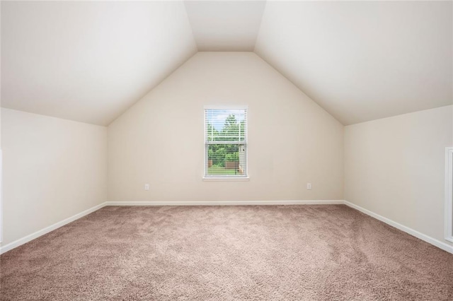 212 Jetta Cir, Mcdonough, GA 30253 - additional living space with carpet floors, vaulted ceiling, and baseboards