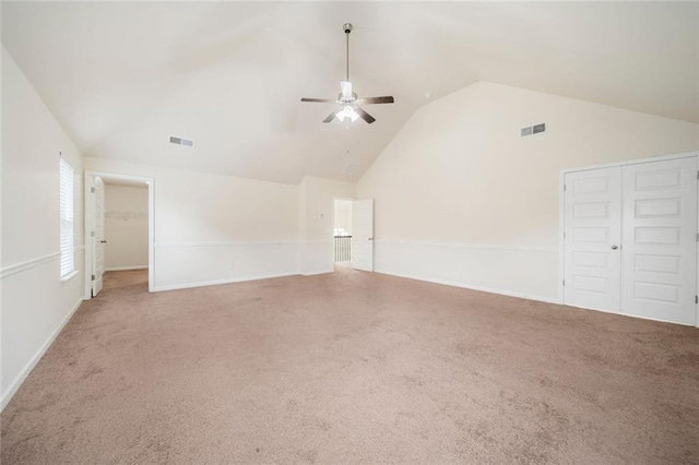 212 Jetta Cir, Mcdonough, GA 30253 - carpeted empty room with vaulted ceiling, ceiling fan, and baseboards
