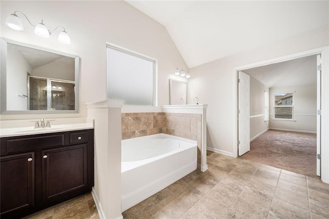212 Jetta Cir, Mcdonough, GA 30253 - full bath featuring lofted ceiling, a garden tub, vanity, and baseboards