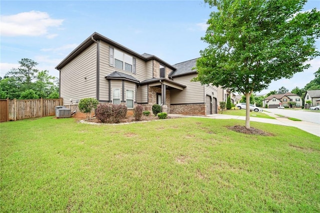 212 Jetta Cir, Mcdonough, GA 30253 - view of front of home featuring driveway, central AC, an attached garage, and stone siding