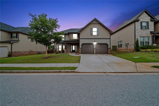 212 Jetta Cir, Mcdonough, GA 30253 - view of front of house with a garage, concrete driveway, a front lawn, and stone siding