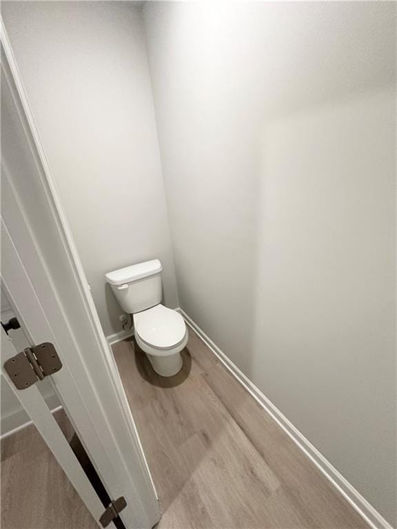 321 Lambert Overlook Cir, Carrollton, GA 30117 - bathroom with toilet, wood finished floors, and baseboards