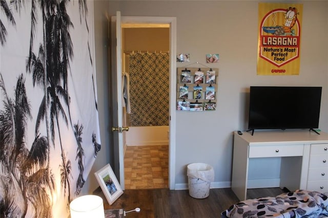 bedroom featuring dark hardwood / wood-style flooring