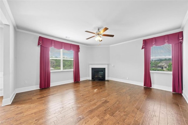 6535 Crosscreek Ln, Flowery Branch, GA 30542 - unfurnished living room with a ceiling fan, a fireplace with flush hearth, hardwood / wood-style floors, and ornamental molding