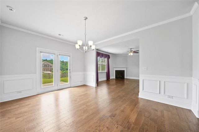 6535 Crosscreek Ln, Flowery Branch, GA 30542 - unfurnished living room with a chandelier, wainscoting, wood finished floors, a fireplace, and ceiling fan