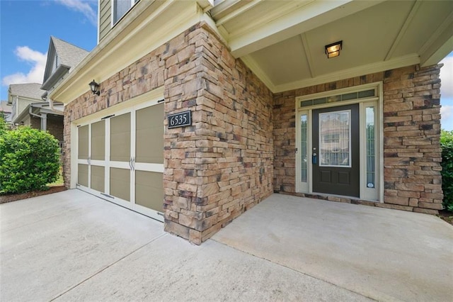 6535 Crosscreek Ln, Flowery Branch, GA 30542 - doorway to property with driveway, an attached garage, stone siding, and roof with shingles