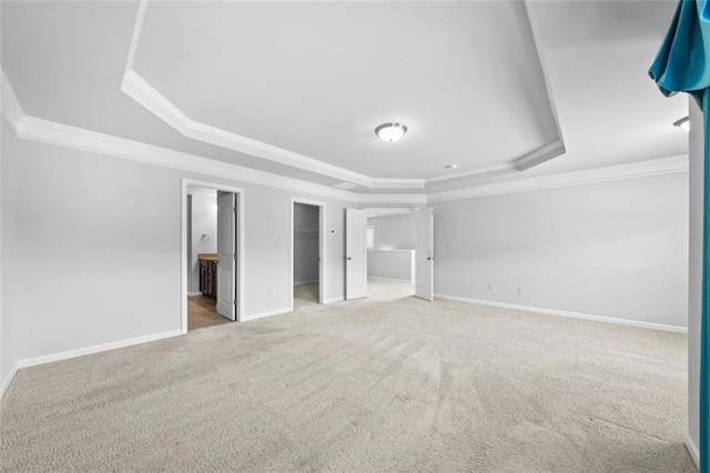 6535 Crosscreek Ln, Flowery Branch, GA 30542 - unfurnished bedroom featuring a raised ceiling, carpet, ornamental molding, a walk in closet, and ensuite bath