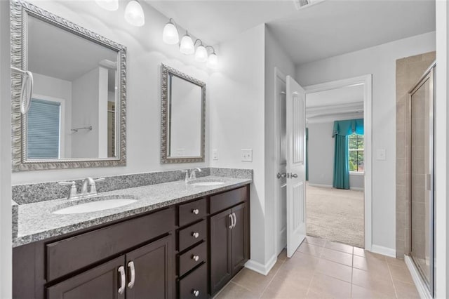 6535 Crosscreek Ln, Flowery Branch, GA 30542 - full bath featuring double vanity, a shower stall, and tile patterned flooring