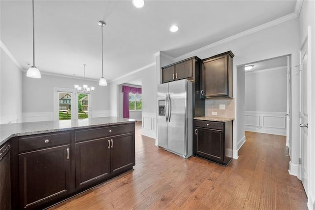 6535 Crosscreek Ln, Flowery Branch, GA 30542 - kitchen with stainless steel refrigerator with ice dispenser, dark brown cabinetry, crown molding, a chandelier, and light wood-style floors