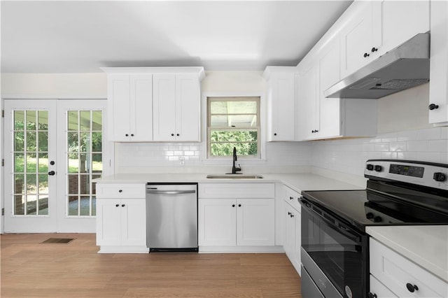 kitchen featuring light hardwood / wood-style floors, sink, appliances with stainless steel finishes, and french doors