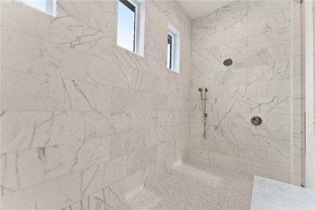 full bathroom with a tile shower