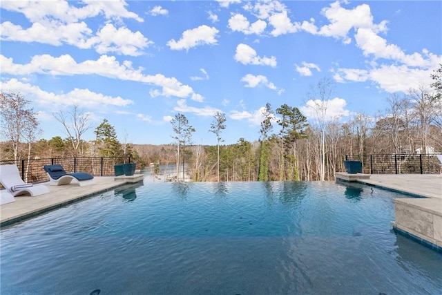 view of pool featuring a patio area and an infinity pool